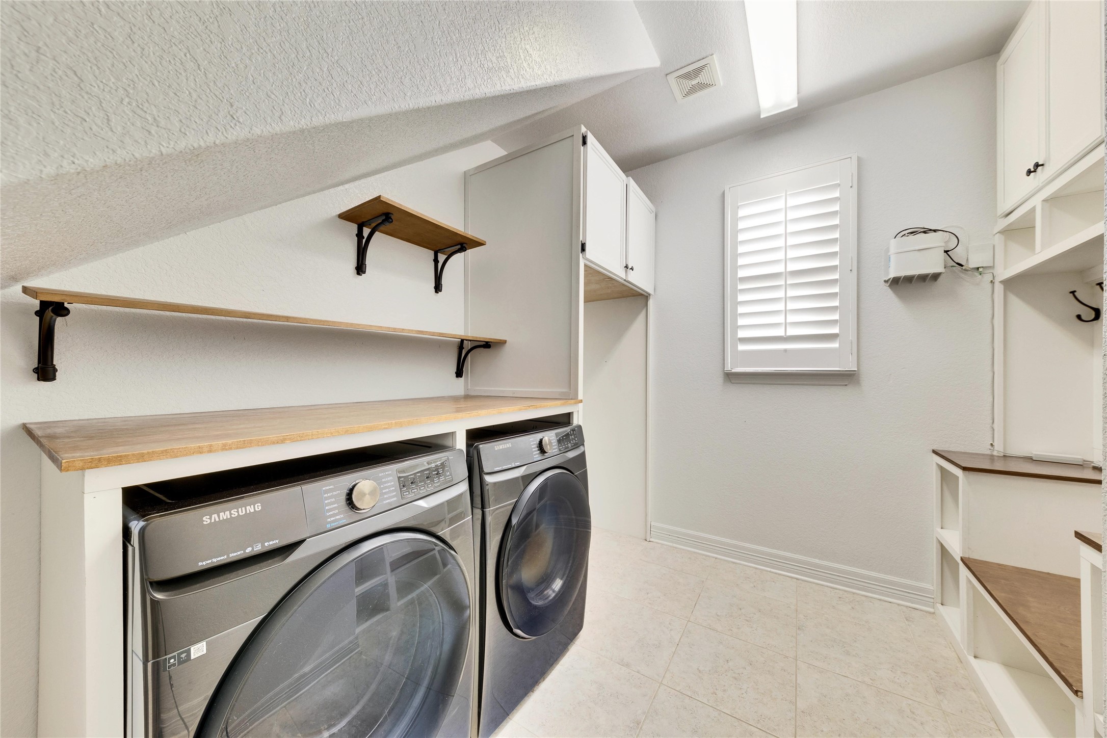5213 Buchanan Draw Road Austin, TX 78738 - Photo 23 of 33 a utility room with dryer and washer