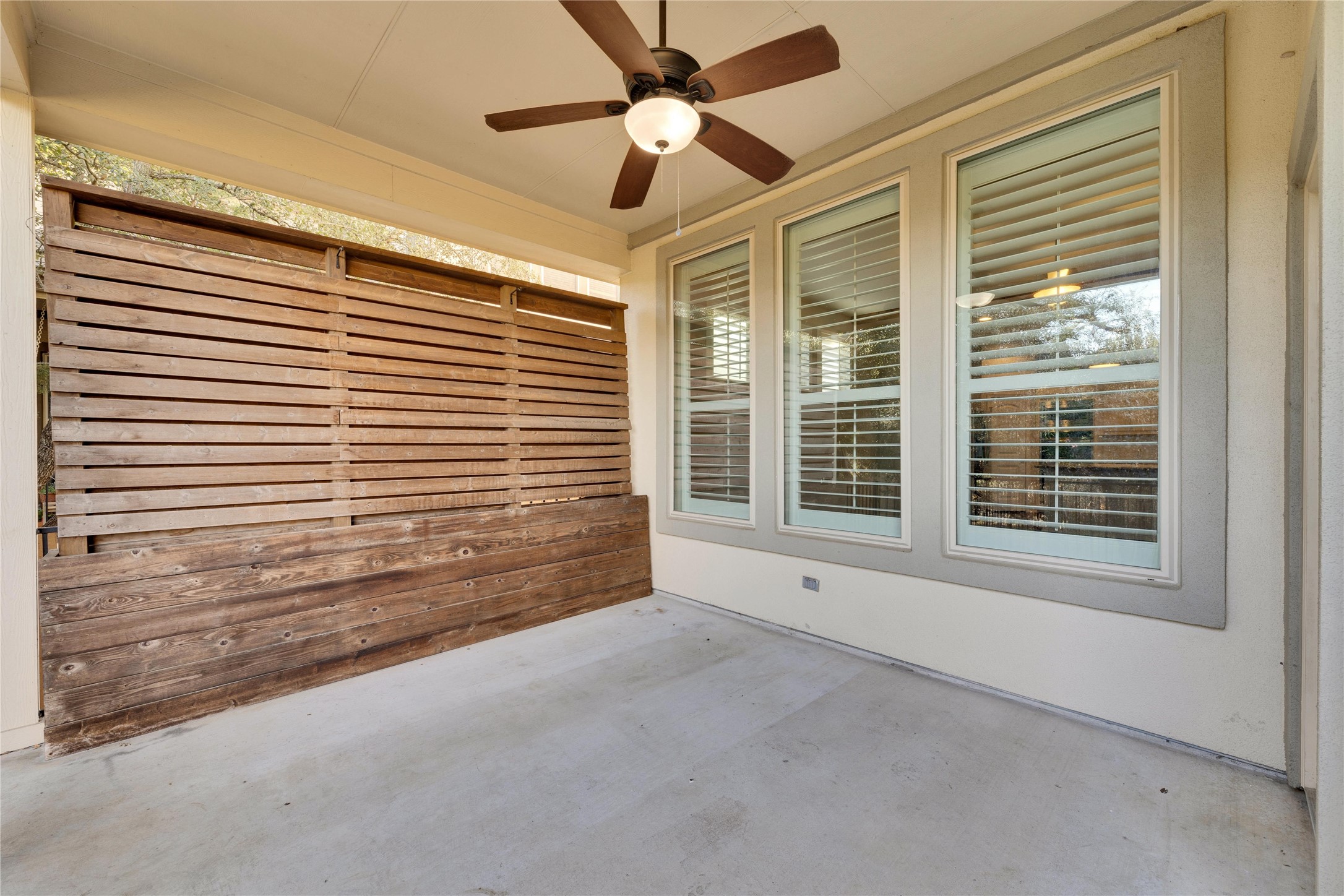 5213 Buchanan Draw Road Austin, TX 78738 - Photo 27 of 33 a view of an empty room with a window and a ceiling fan