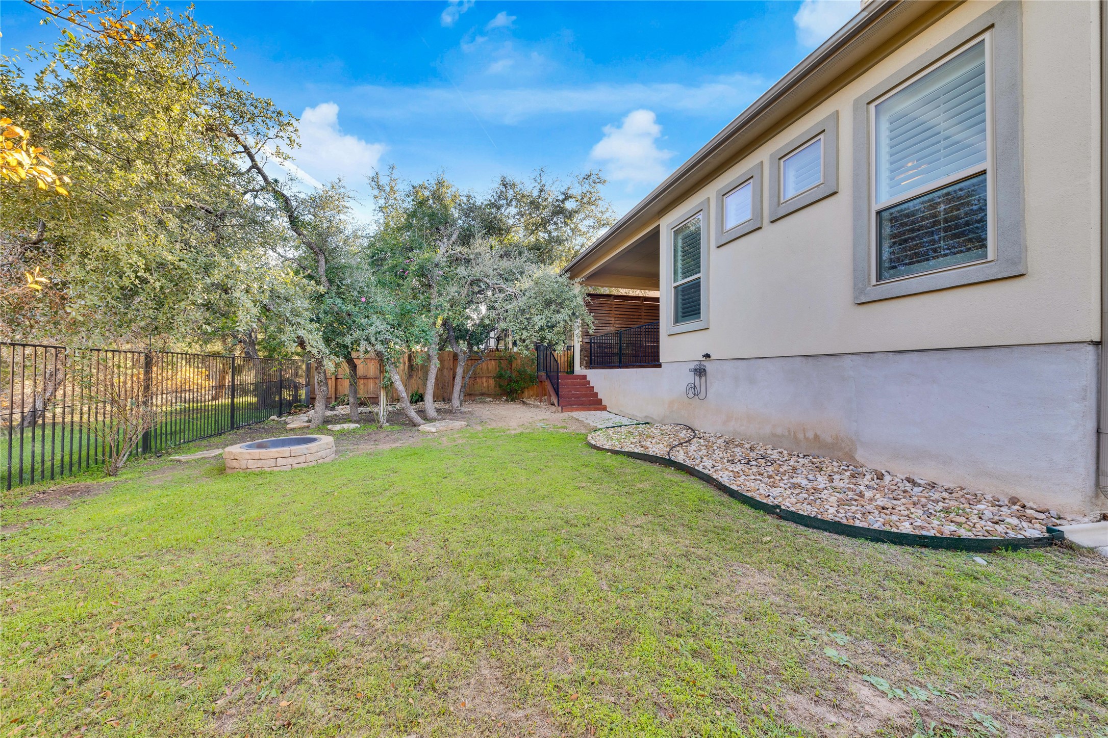 5213 Buchanan Draw Road Austin, TX 78738 - Photo 28 of 33 a view of a house with backyard and sitting area