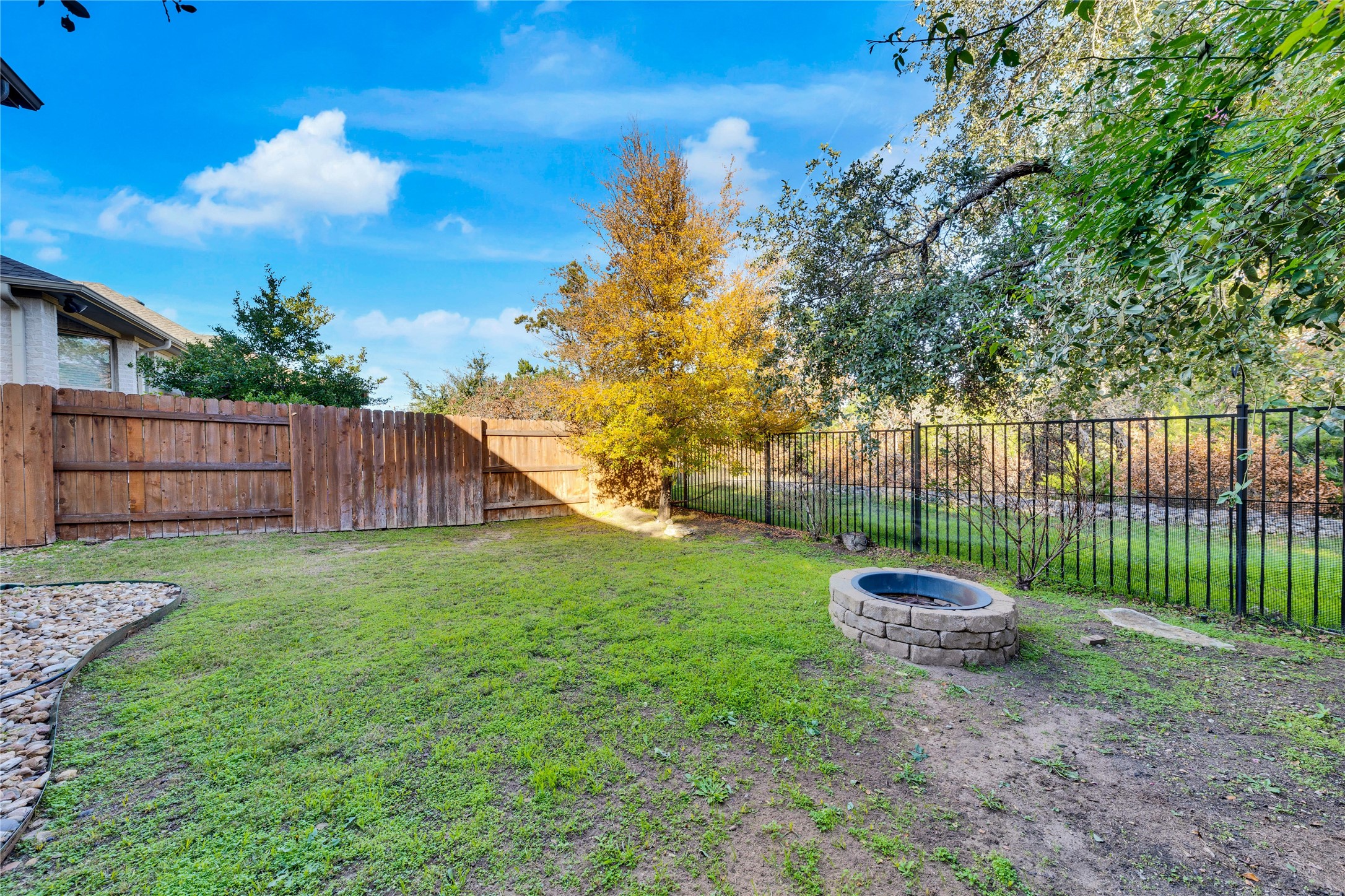 5213 Buchanan Draw Road Austin, TX 78738 - Photo 29 of 33 a backyard of a house with lots of green space