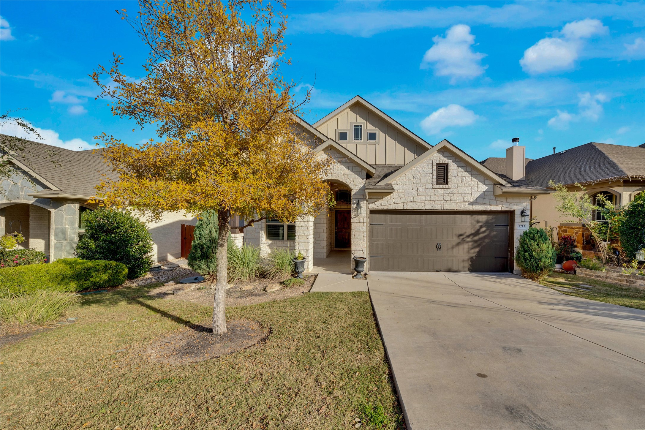 5213 Buchanan Draw Road Austin, TX 78738 - Photo 31 of 33 a front view of a house with a yard