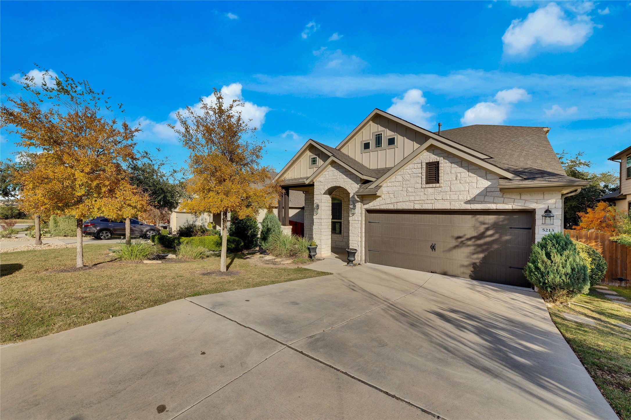 5213 Buchanan Draw Road Austin, TX 78738 - Photo 32 of 33 a front view of a house with a yard