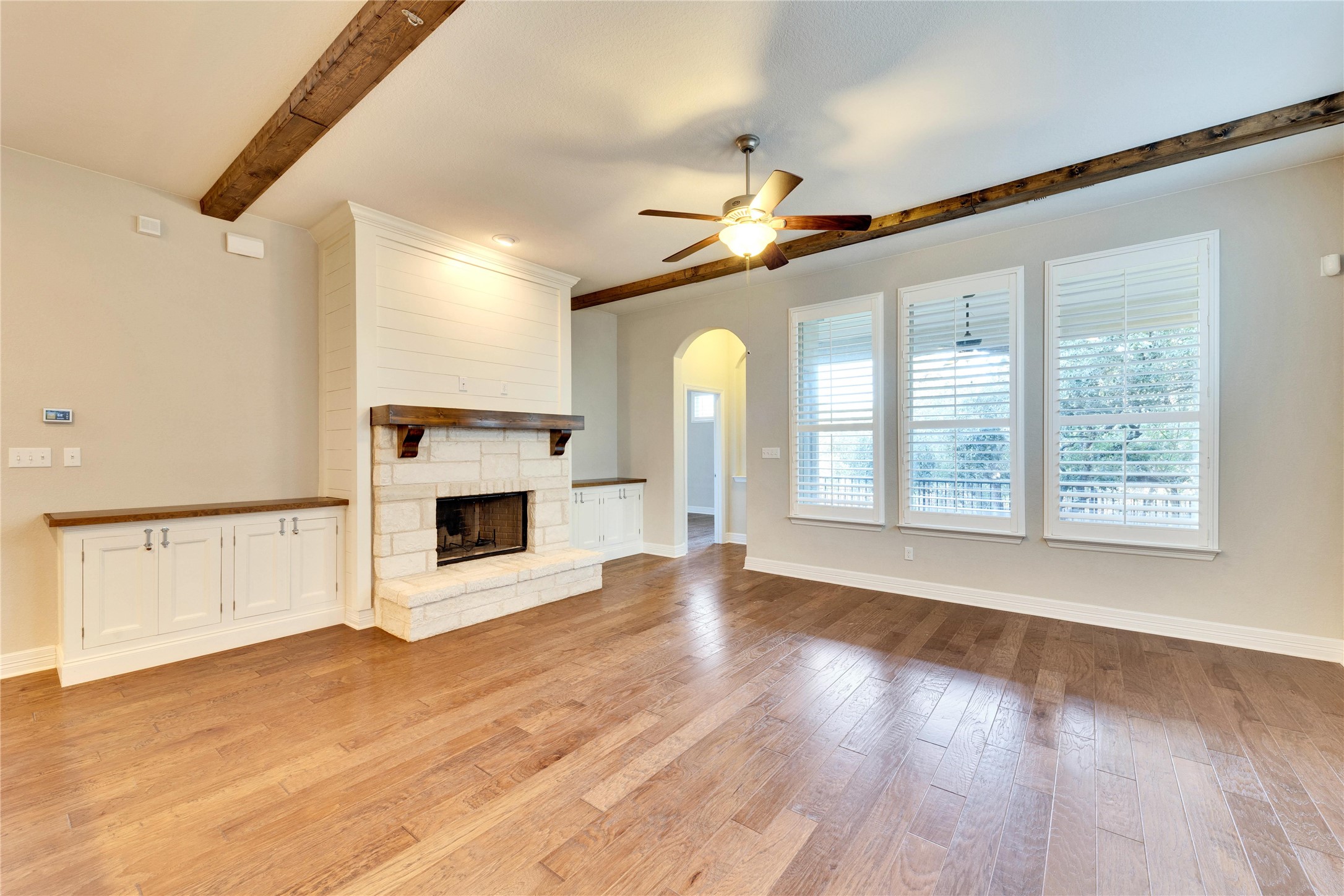 5213 Buchanan Draw Road Austin, TX 78738 - Photo 9 of 33 a view of an empty room with exposed radiator and fireplace
