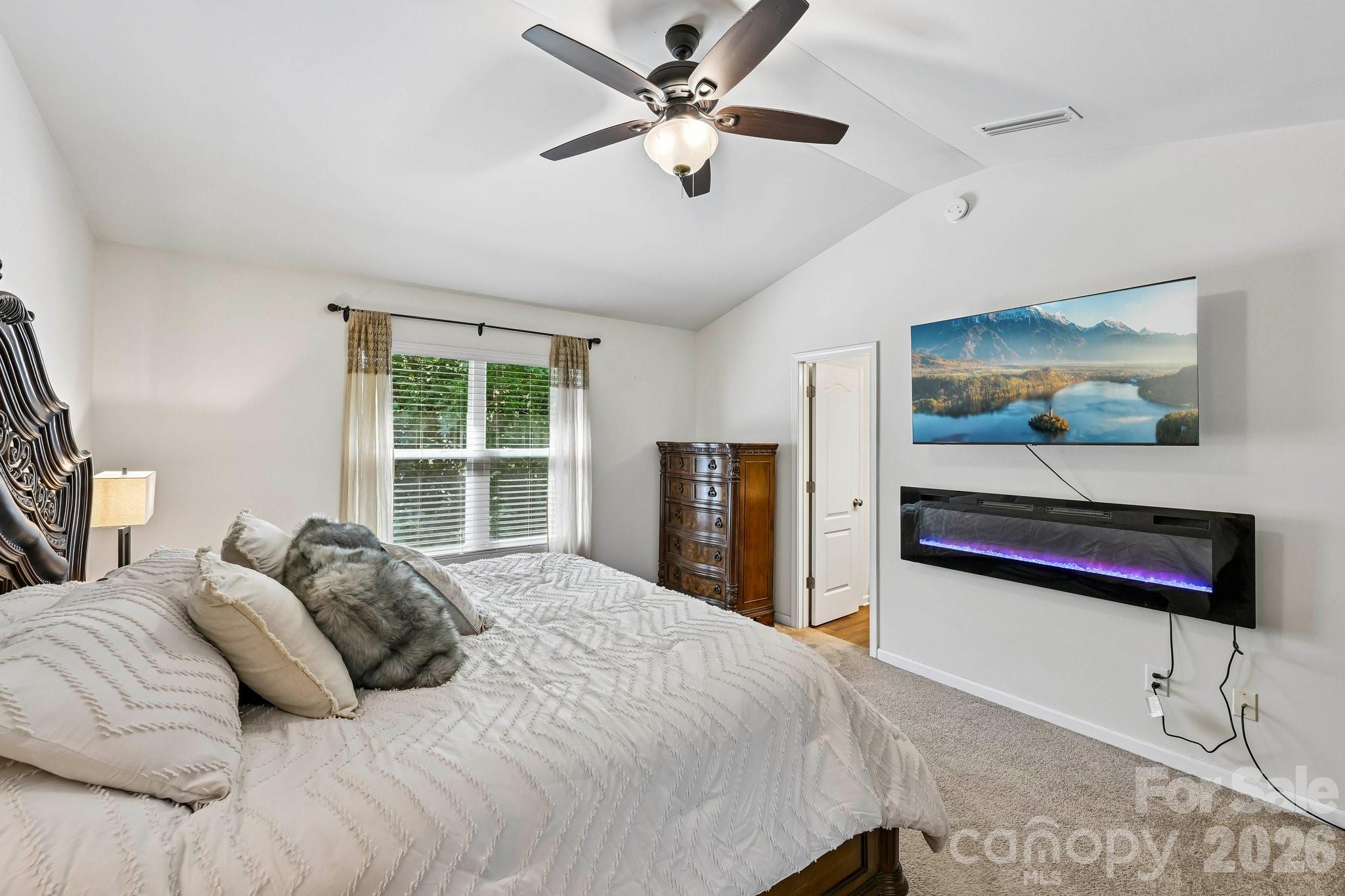 2206 Turtle Point Road Charlotte, NC 28262 - Photo 16 of 28 a bedroom with a bed and a painting on the wall