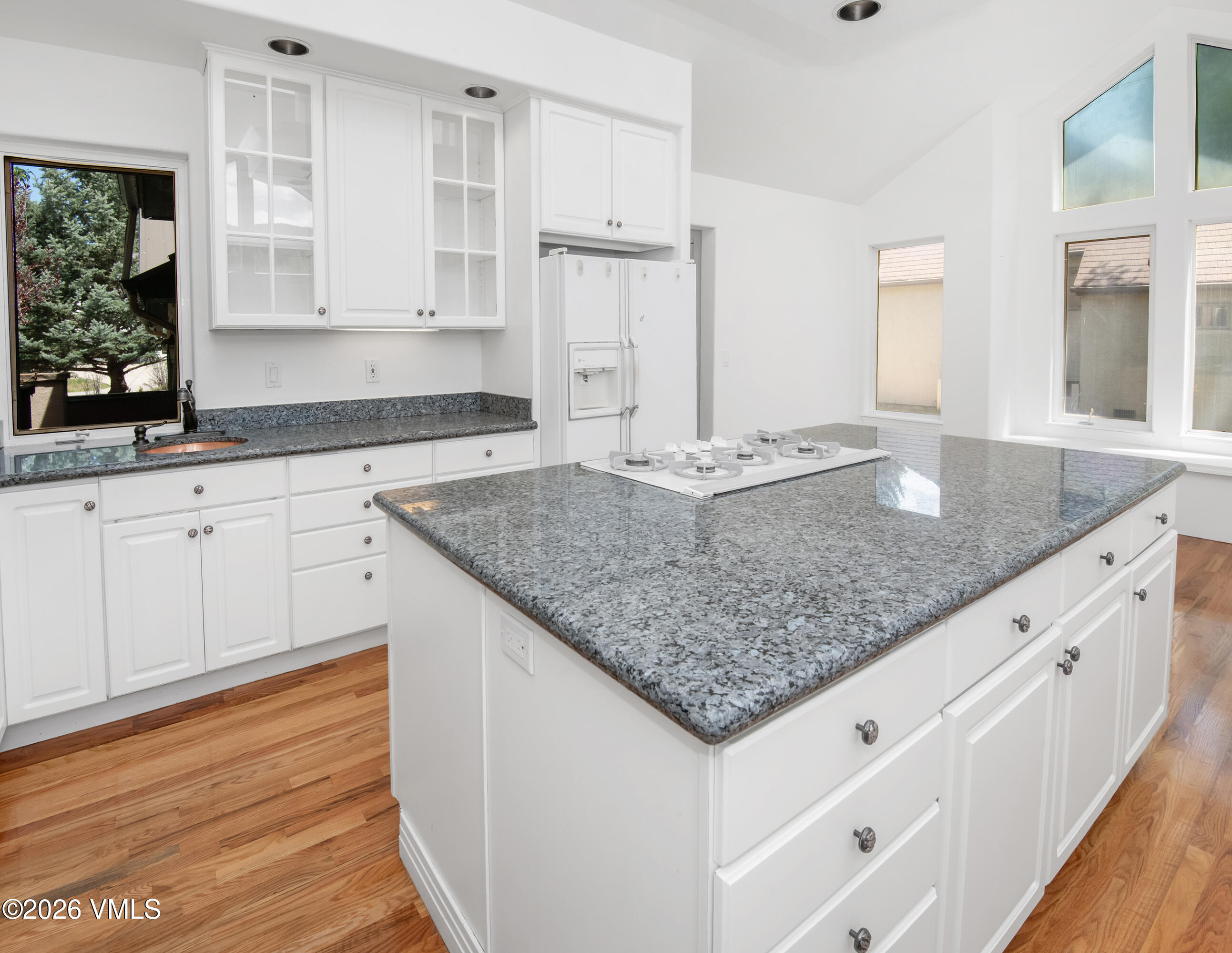 471 Rawhide Road Edwards, CO 81632 - Photo 13 of 51 a kitchen with granite countertop white cabinets and a granite counter tops