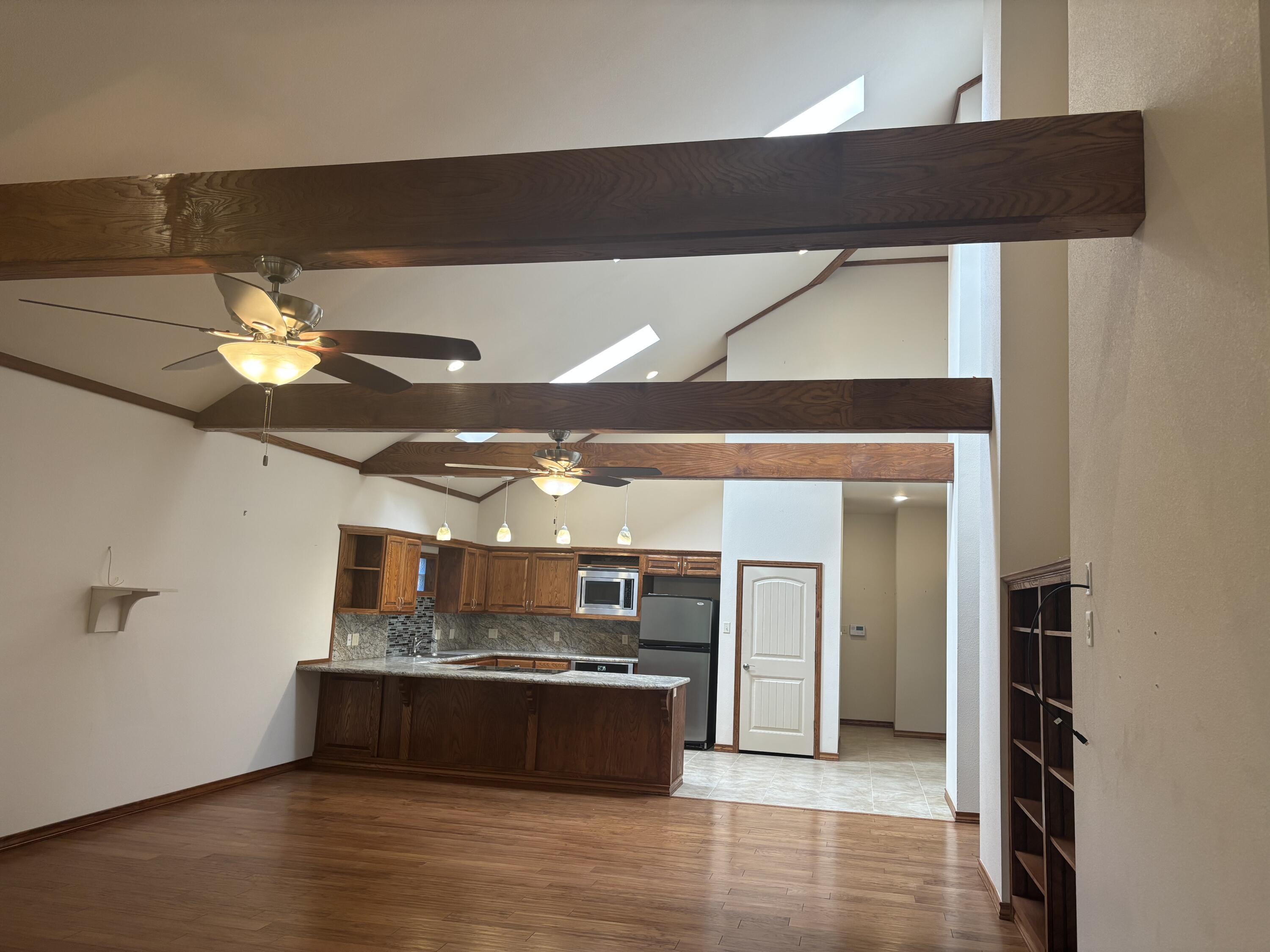 33 West Lakeshore Drive Ransom Canyon, TX 79366 - Photo 23 of 48 a view of a living room with kitchen