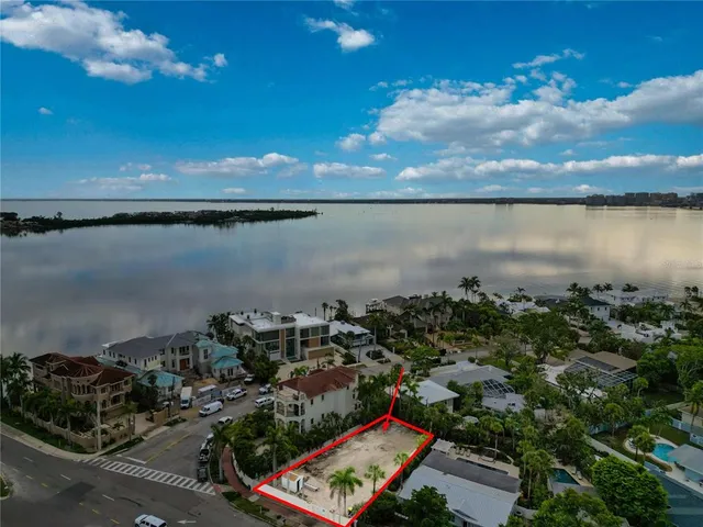an aerial view of a city with lake view