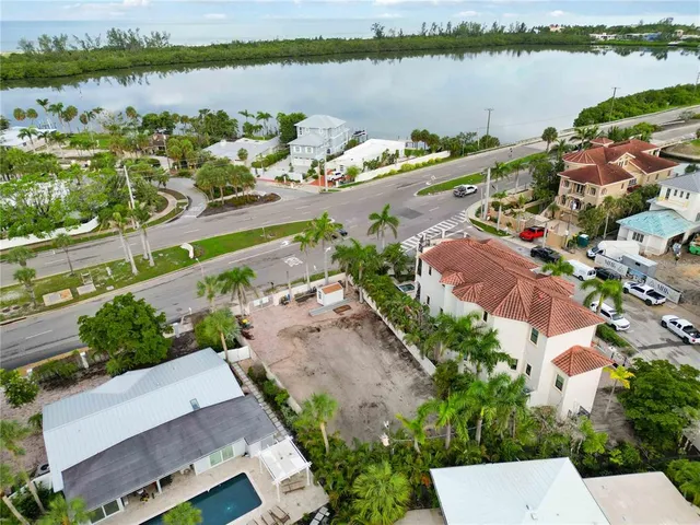 an aerial view of a house with a yard and a outdoor space