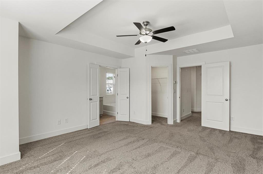 6347 Princeton Ridge Drive Lithonia, GA 30058 - Photo 21 of 28 a view of a livingroom with a chandelier fan and closet area