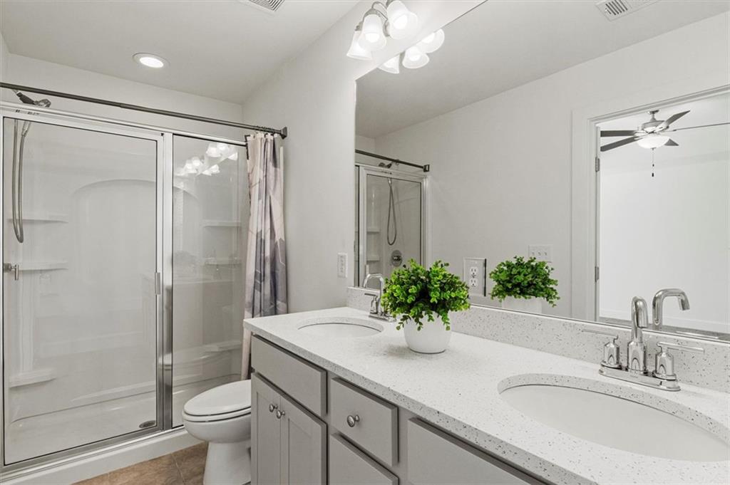 6347 Princeton Ridge Drive Lithonia, GA 30058 - Photo 22 of 28 a bathroom with a sink a toilet and shower