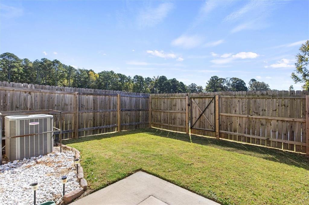 6347 Princeton Ridge Drive Lithonia, GA 30058 - Photo 25 of 28 a view of a backyard with a small cabin