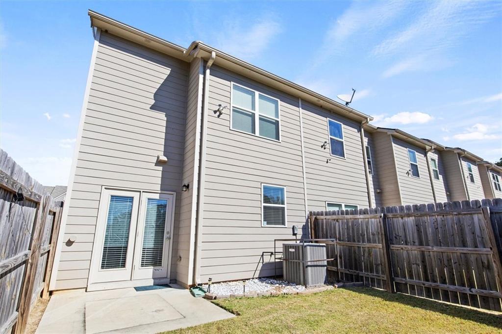 6347 Princeton Ridge Drive Lithonia, GA 30058 - Photo 26 of 28 a view of a house with a backyard