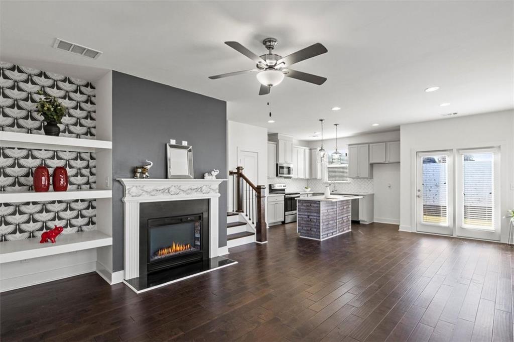 6347 Princeton Ridge Drive Lithonia, GA 30058 - Photo 5 of 28 a living room with furniture and a fireplace