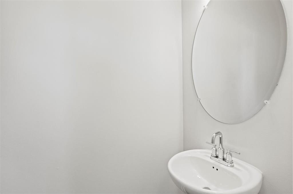 6347 Princeton Ridge Drive Lithonia, GA 30058 - Photo 7 of 28 a bathroom with a sink and a mirror
