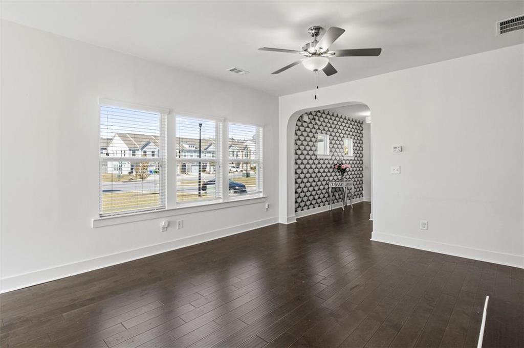6347 Princeton Ridge Drive Lithonia, GA 30058 - Photo 9 of 28 wooden floor in an empty room with a window