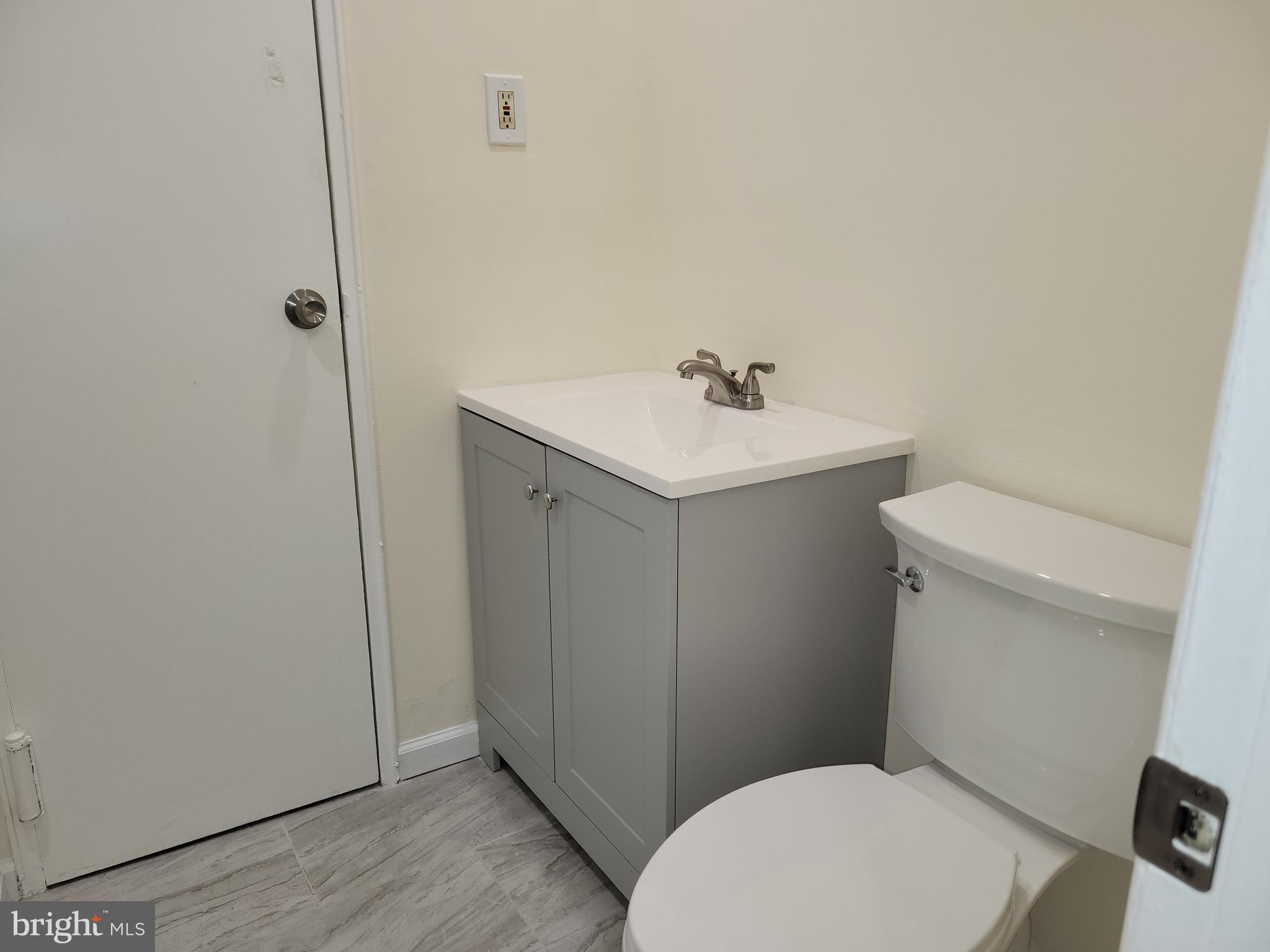 Avon Drive, Unit J East Windsor, NJ 08520 - Photo 14 of 15 a white toilet sitting next to a bathroom sink