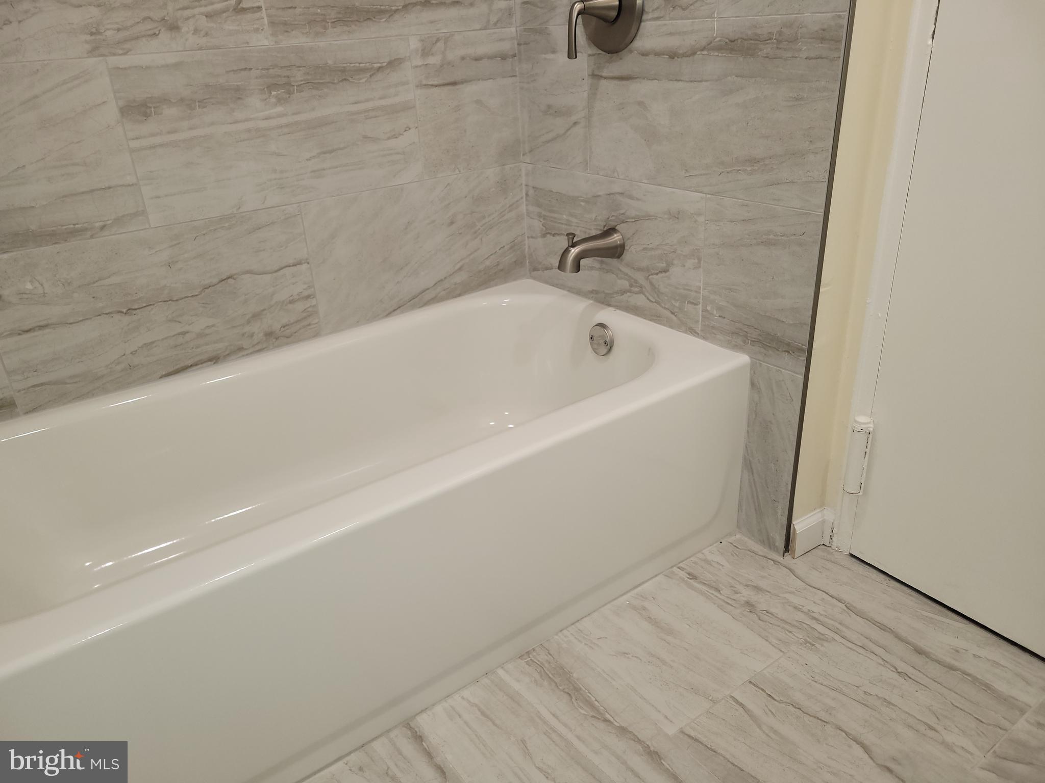 Avon Drive, Unit J East Windsor, NJ 08520 - Photo 15 of 15 a bathroom with a bathtub