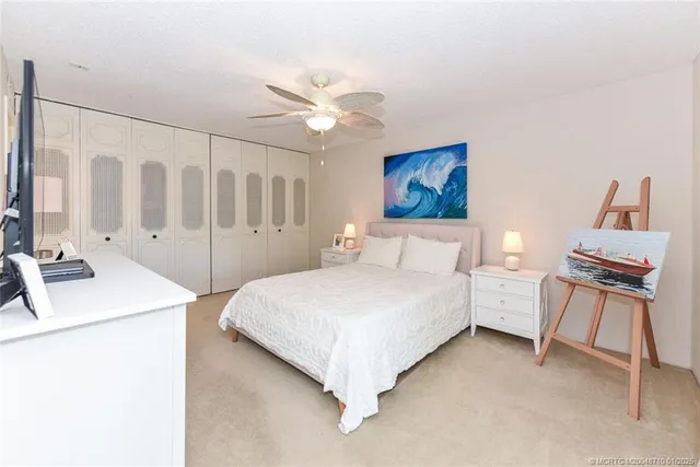 a wooden bench sitting in front of a building