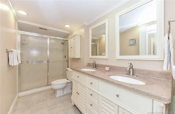 a bed room with a bed and a chandelier