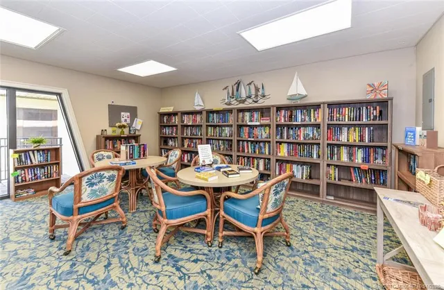 a view of a dining room with furniture and a table