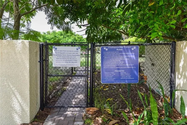 a view of a brick wall in front of a house