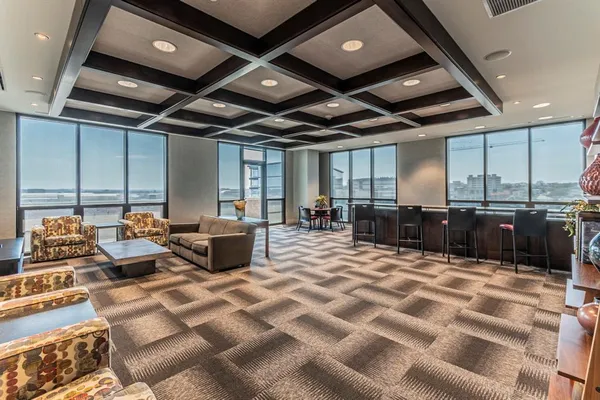 a view of a balcony with two chairs and a table