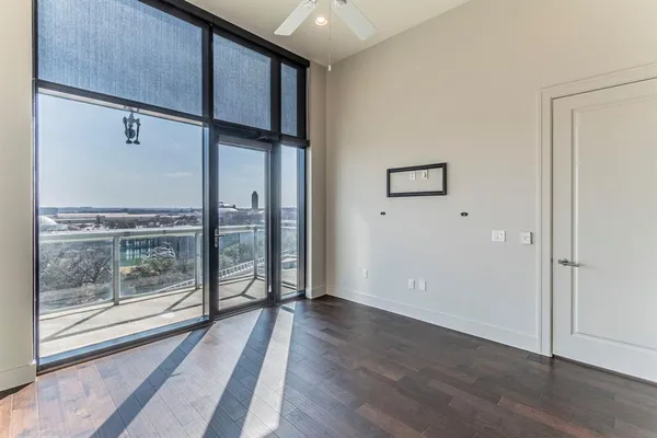 a view of wooden floor and windows in a room