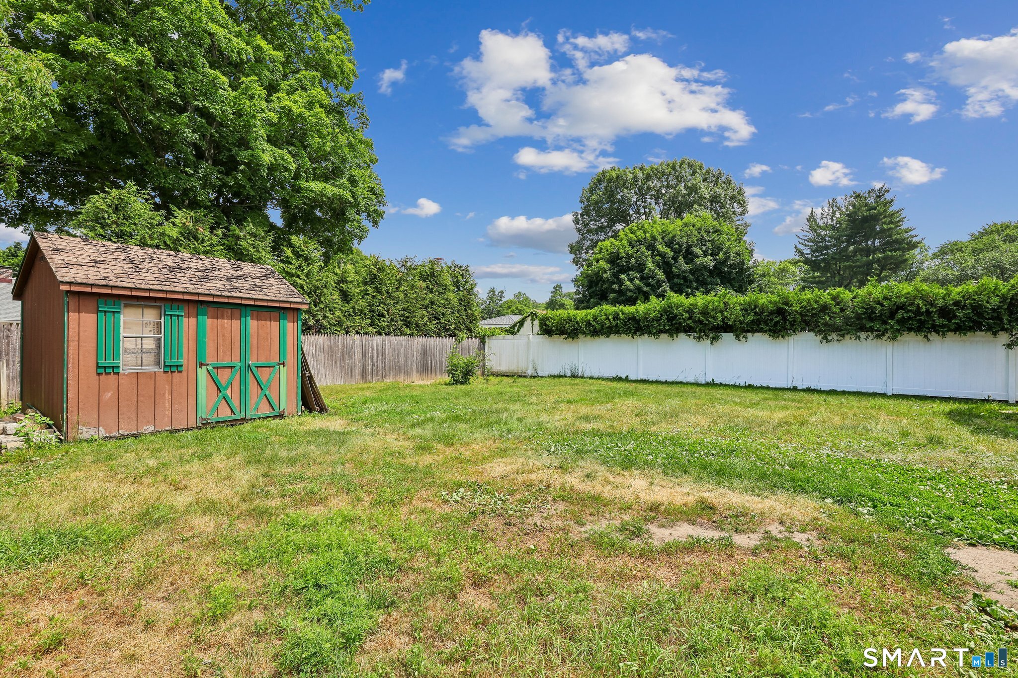 21 Friendly Road Norwalk, CT 06851 - Photo 21 of 28 Private, fenced-in level lot has endless possibilities for buyers who enjoy their outdoor space!