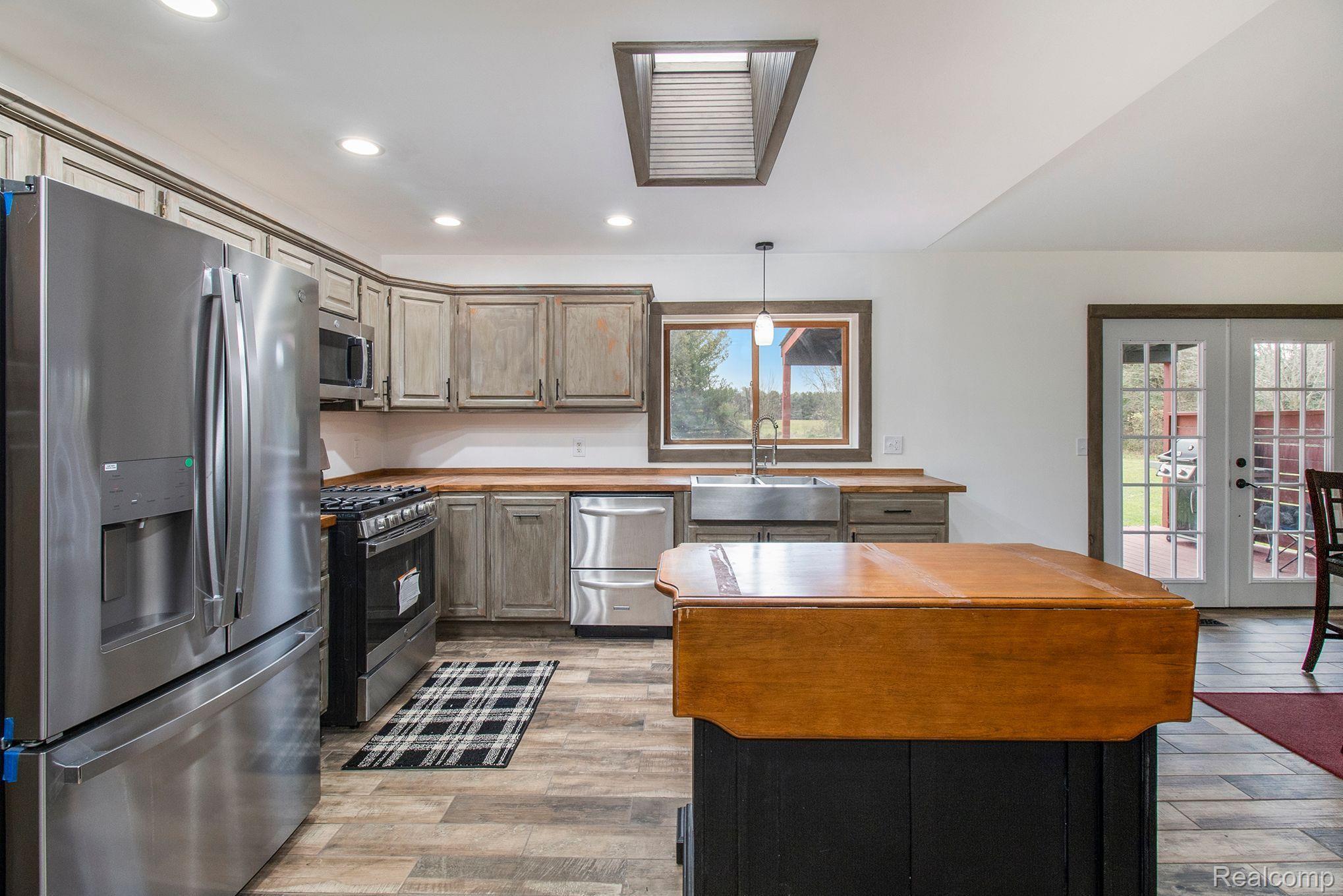10330 East Potter Road Davison, MI 48423 - Photo 9 of 45 Beautiful Kitchen with Custom Skylight