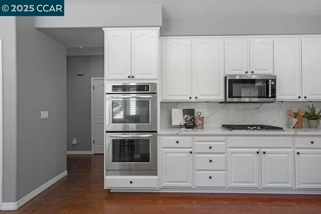 a kitchen with a table and chairs in it
