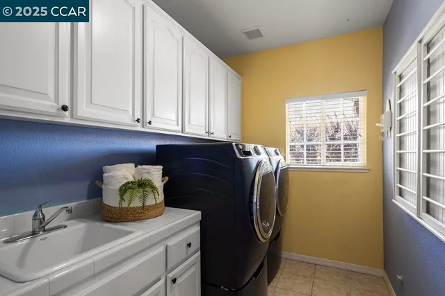 a bathroom with a bathtub and window