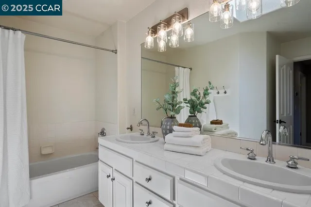 a front view of a house with a yard balcony and seating space