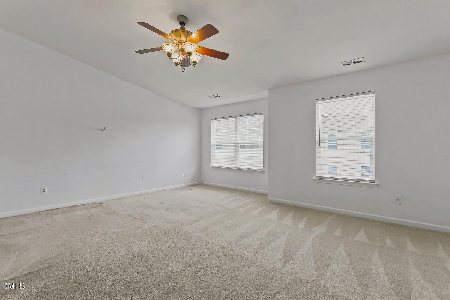 8620 Neuse Club Lane, Unit 107 Raleigh, NC 27616 - Photo 19 of 33 019-019-Primary Bedroom-1500x1000