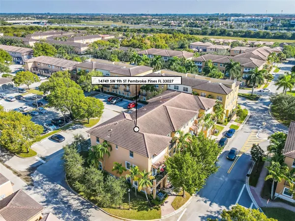 an aerial view of house with yard