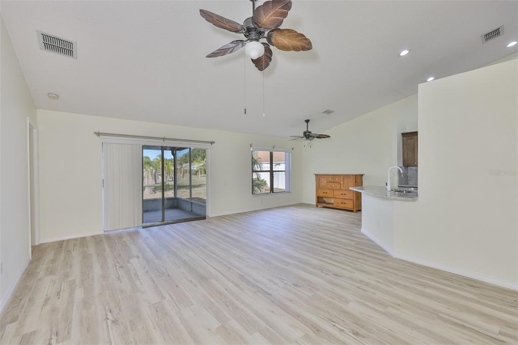 219 Island Water Way Apollo Beach, FL 33572 - Photo 17 of 34 a view of empty room with wooden floor and fan