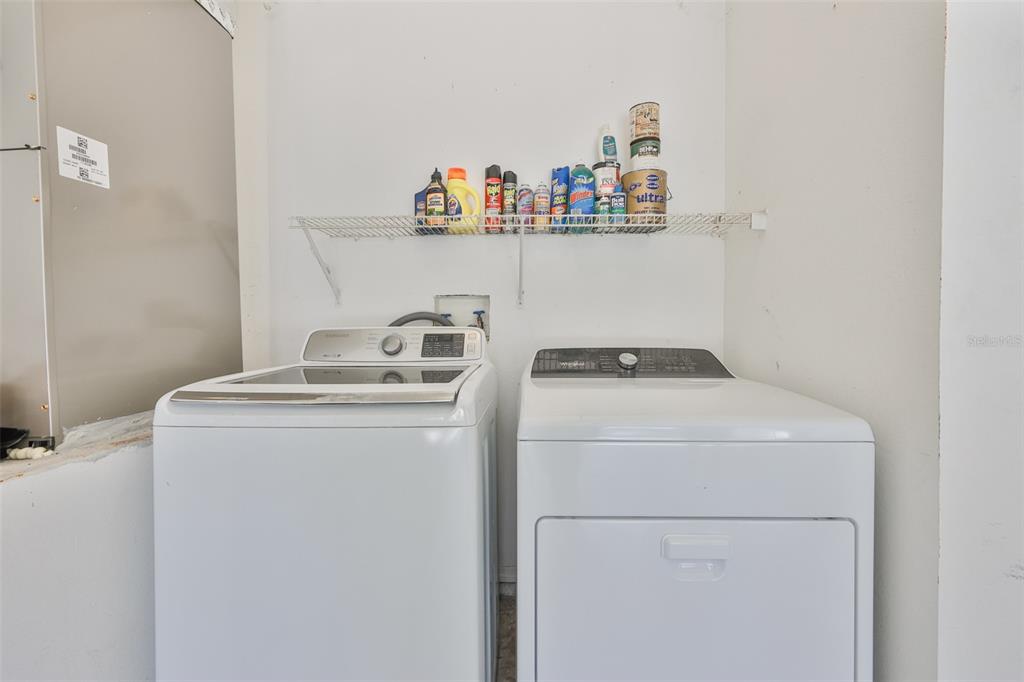 219 Island Water Way Apollo Beach, FL 33572 - Photo 24 of 34 a utility room with dryer and washer