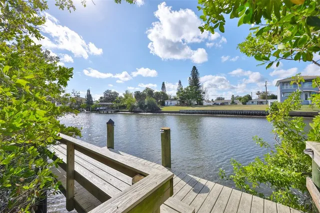a view of a lake with a house in the background