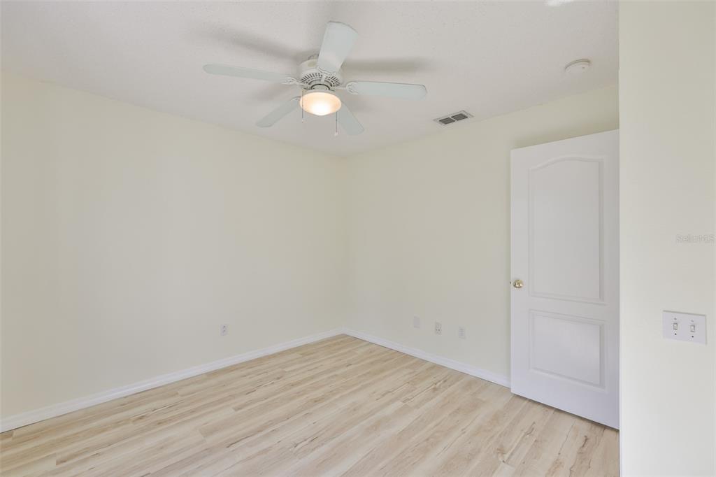 219 Island Water Way Apollo Beach, FL 33572 - Photo 9 of 34 a view of an empty room with wooden floor