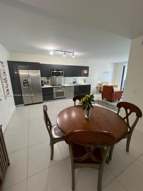 31 Southeast 6th Street, Unit 1606 Miami, FL 33131 - Photo 11 of 27 a living room with furniture and chandelier