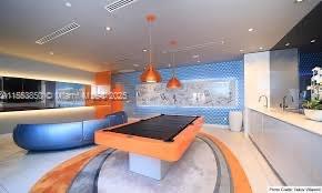 31 Southeast 6th Street, Unit 1606 Miami, FL 33131 - Photo 27 of 27 a living room with a couch and a fireplace