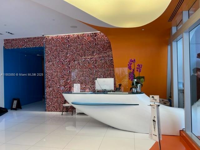 31 Southeast 6th Street, Unit 1606 Miami, FL 33131 - Photo 3 of 27 a living room with furniture and a fireplace