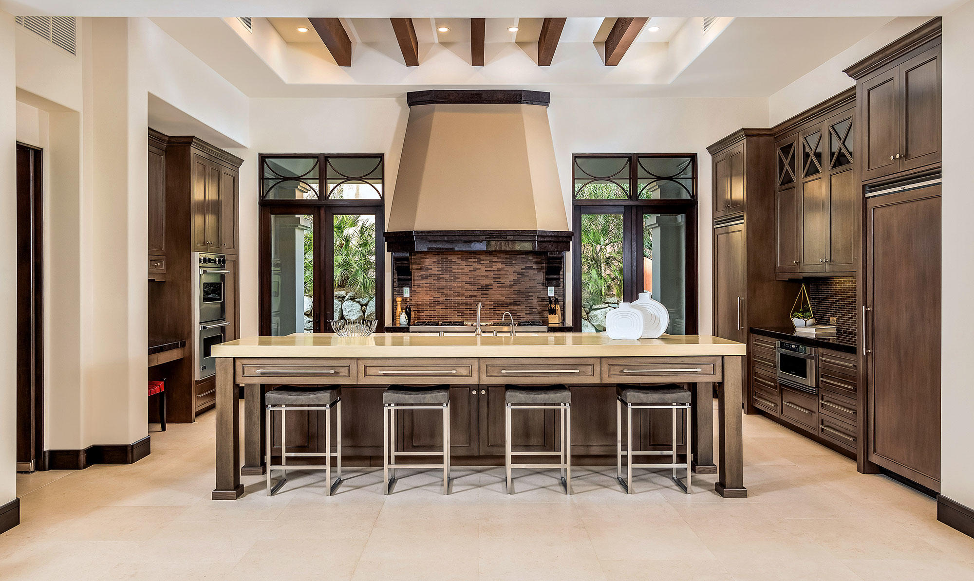 1011 Mountain Spring Palm Desert, CA 92260 - Photo 4 of 16 a kitchen with stainless steel appliances granite countertop a stove and a refrigerator