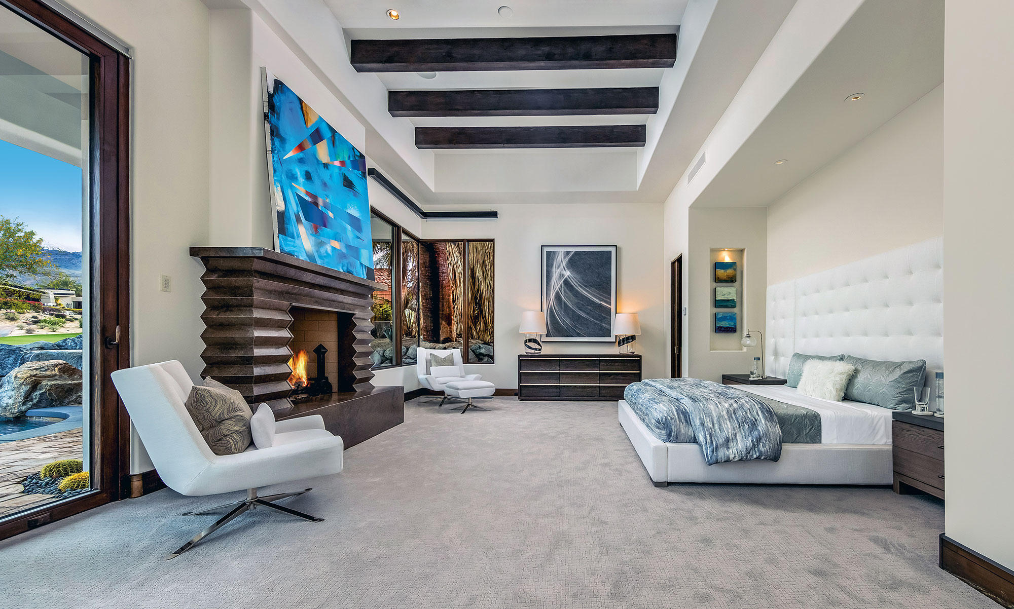 1011 Mountain Spring Palm Desert, CA 92260 - Photo 7 of 16 a living room with furniture and a fireplace