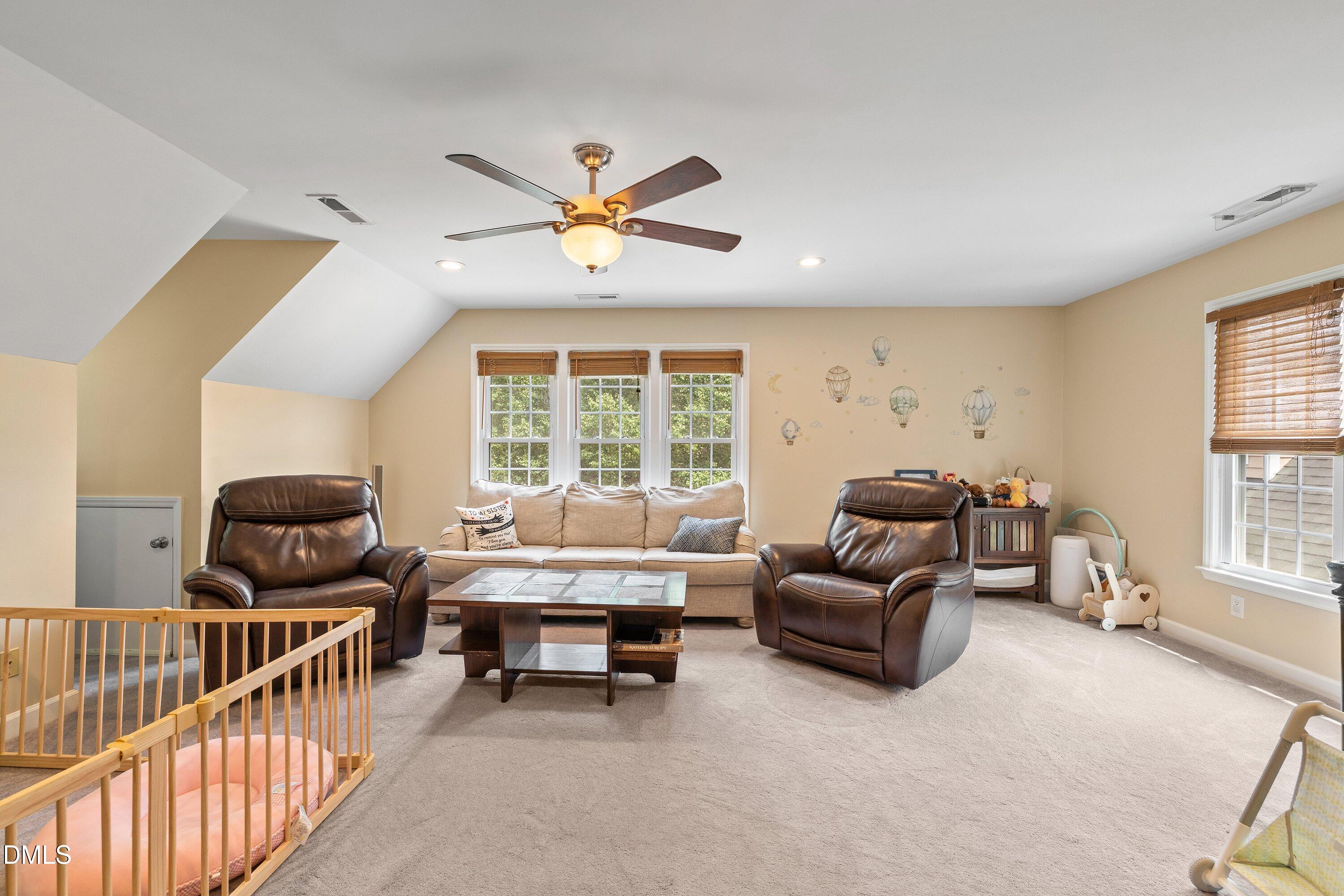 6612 Fowler Road Zebulon, NC 27597 - Photo 29 of 42 a living room with furniture and a large window