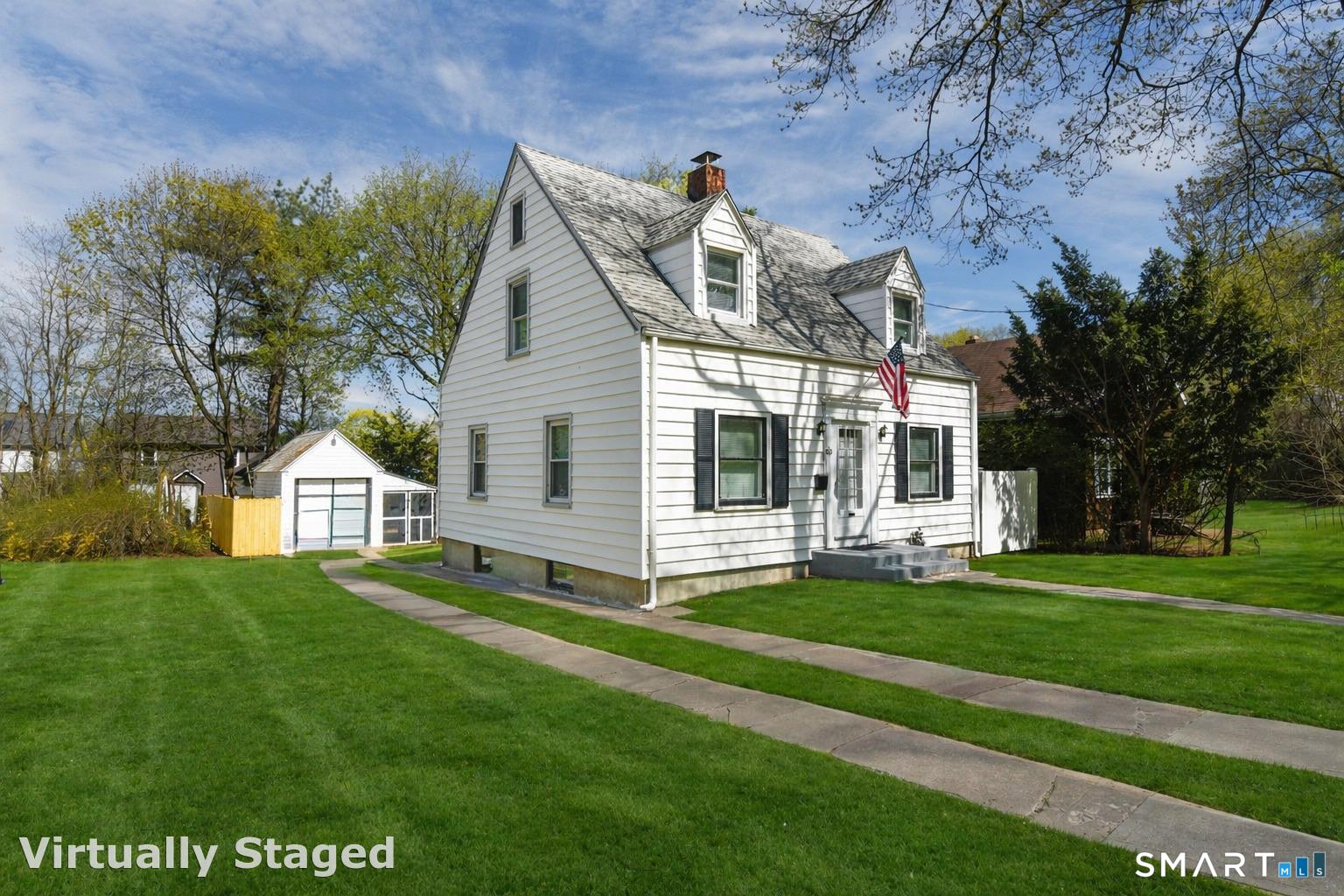 63 Park Road Hamden, CT 06517 - Photo 2 of 39 a front view of a house with a yard