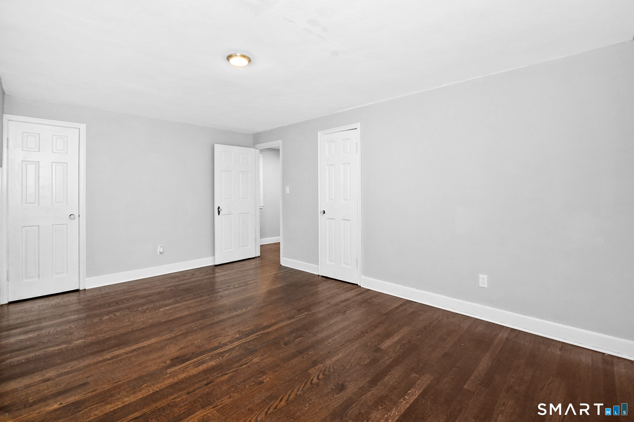 63 Park Road Hamden, CT 06517 - Photo 22 of 39 a view of an empty room with wooden floor