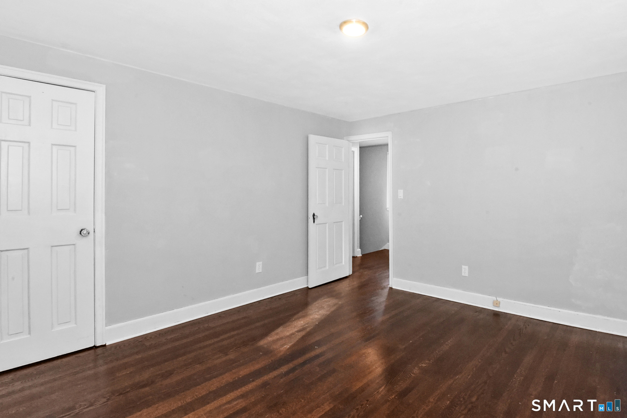 63 Park Road Hamden, CT 06517 - Photo 24 of 39 a view of an empty room with wooden floor
