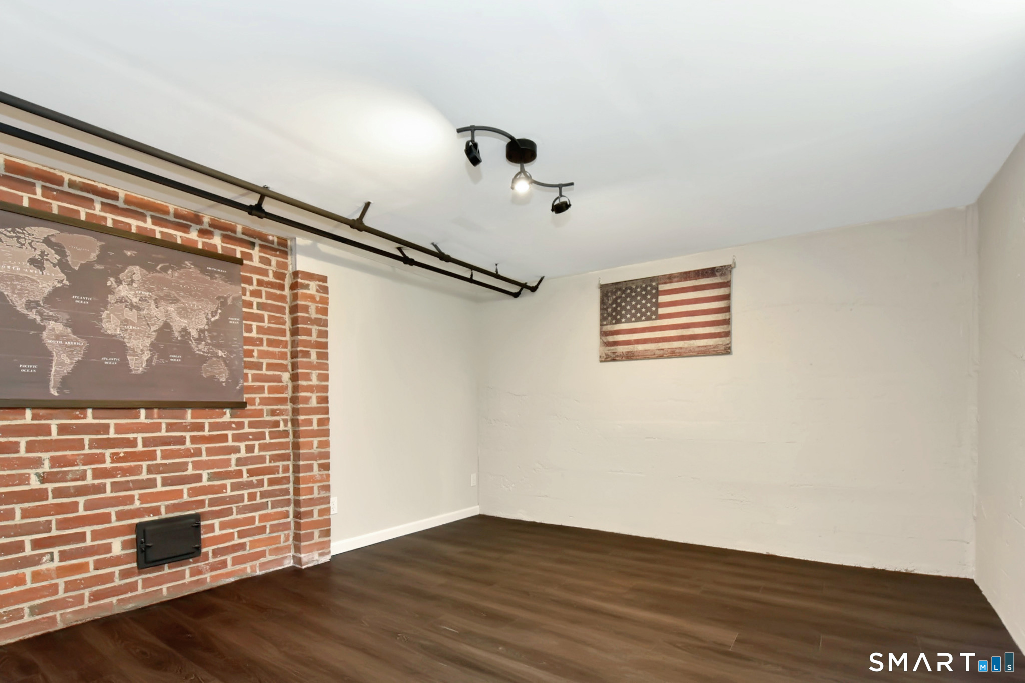 63 Park Road Hamden, CT 06517 - Photo 31 of 39 a view of an empty room with wooden floor