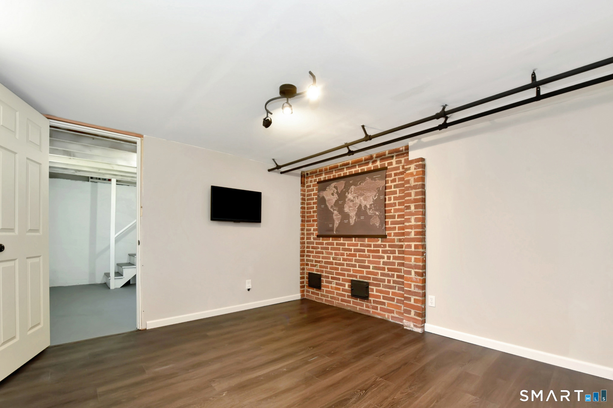 63 Park Road Hamden, CT 06517 - Photo 32 of 39 a view of an empty room with wooden floor and a window