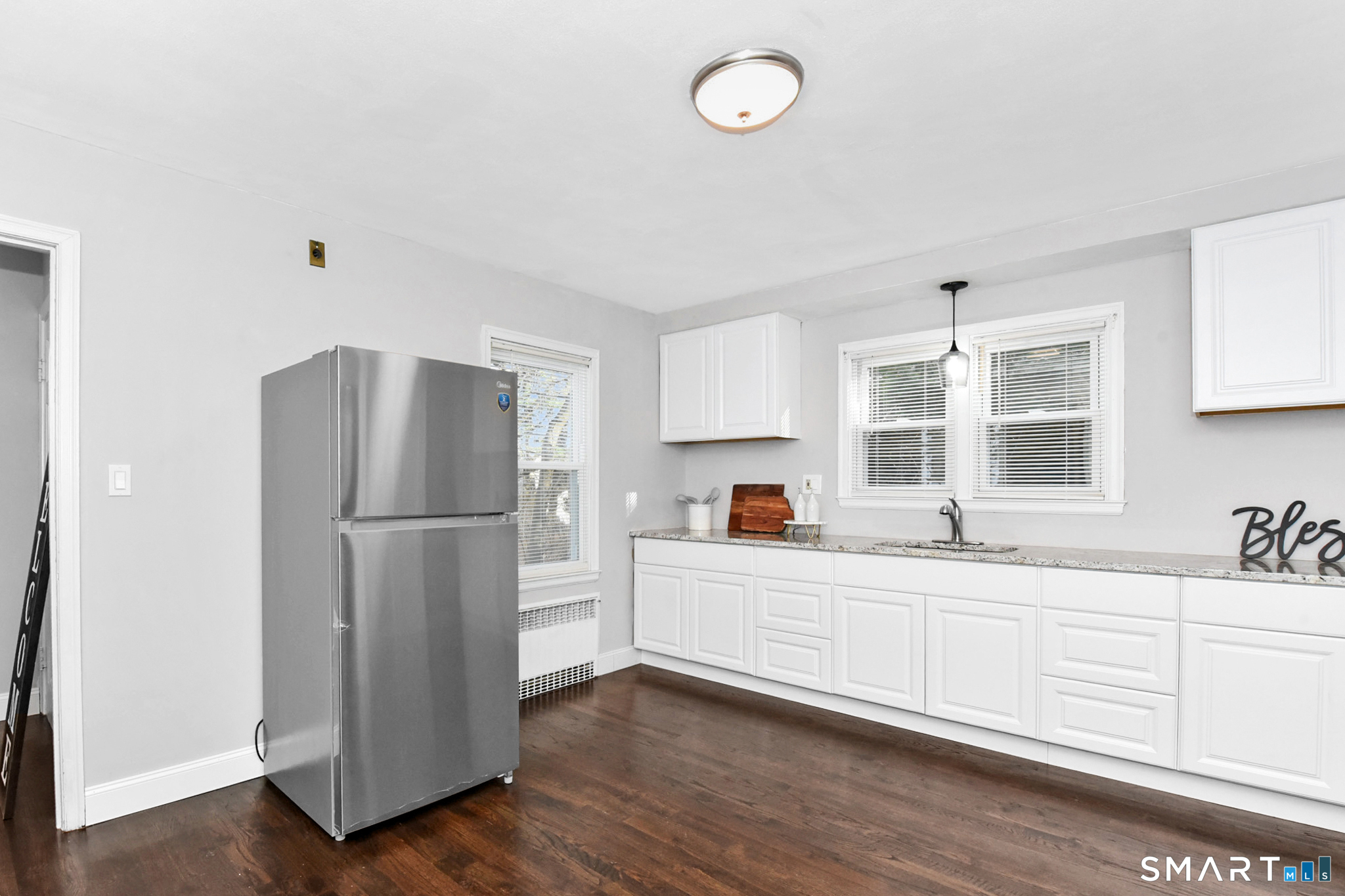 63 Park Road Hamden, CT 06517 - Photo 4 of 39 a kitchen with stainless steel appliances a refrigerator sink and cabinets